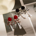 Red and Black Flocked Rose Bow Pearl Look Dangle Earrings view 1