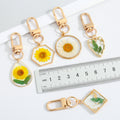 Gold Tone Pressed Flower Resin Clip Keychains in Four Shapes view 4