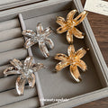 Sculpted Metal Flower Stud Earrings in Gold Tone or Silver Tone view 3