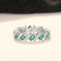 Green And Clear Baguette Woven Eternity Band In Silver Tone view 5