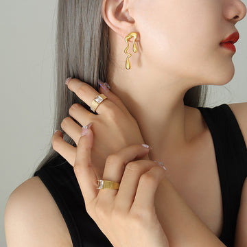 Asymmetric Liquid Drop Stud Earrings Gold And Steel Pair