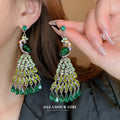 Green Crystal Peacock Chandelier Drop Earrings with Polished Metal Accents view 2