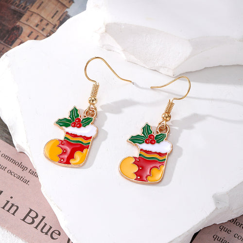 Red and yellow Christmas stocking enamel dangle earrings on white stone