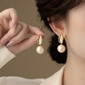 Gold Sculpted Metal And White Pearl Drop Earrings Statement Jewelry view 2