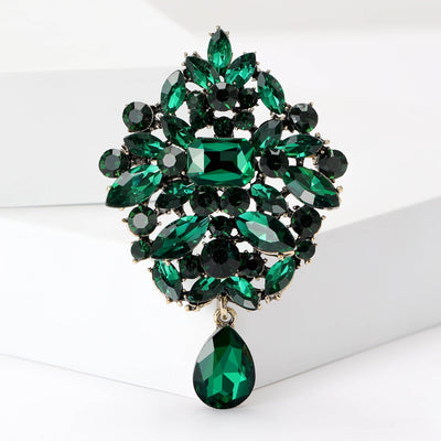 Front view of the oval floral crystal dangle brooch showing an oval floral crystal cluster with a matching teardrop dang