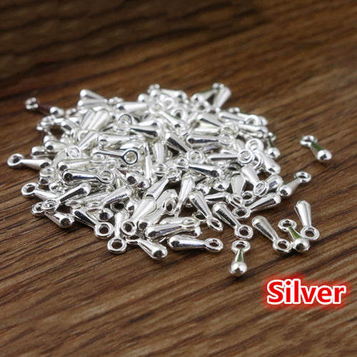 Small teardrop end charms in five metal finishes shown in a closer grouped view