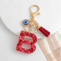 Red Resin Shell Letter Keychain with Evil Eye and Tassel view 6