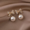 Gold Tone Bow and Pearl Drop Stud Earrings in Two Colors view 7