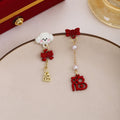 Mismatched Dog Bow and Blessing Long Stud Earrings view 4
