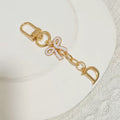 Gold Tone Initial Letter Bag Charm with Pastel Enamel Bow view 8