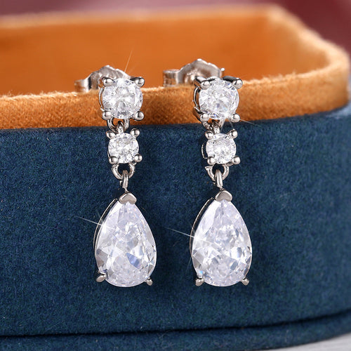 Second product view showing silver-tone three-stone pear-shaped long drop earrings