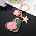 Clear Resin Pressed Flower Heart Clip Keychains in Five Designs view 6