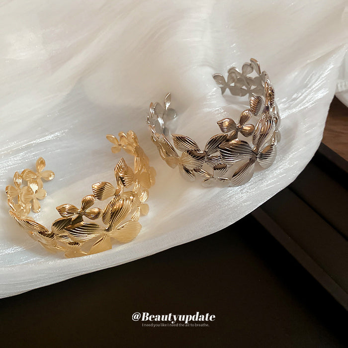 Gold Tone Wide Openwork Bracelet With Layered Textured Flowers And Leaves