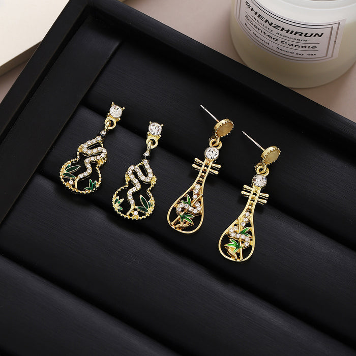 Gold Tone Pipa Leaf Openwork Long Dangle Stud Earrings