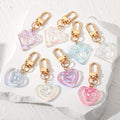 Gold Tone Iridescent Acrylic Heart and Gem Clip Keychains view 1
