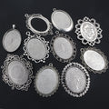 Assorted Ornate Oval Cabochon Pendant Trays in Silver Tone Metal view 1
