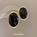 Gold Tone Oval Resin Stud Earrings in Black and Burgundy view 2