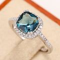 Deep Blue Cushion Solitaire Halo Ring In Polished Silver Tone view 2