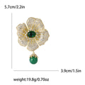 Green Center Flower Brooch With Hanging Bead With Polished Metal Detail view 4