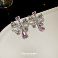 Silver Tone Crystal Bow Stud Earrings With Pink Teardrop Accents view 4