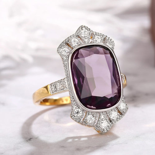 Side view of gold tone purple rectangle statement ring