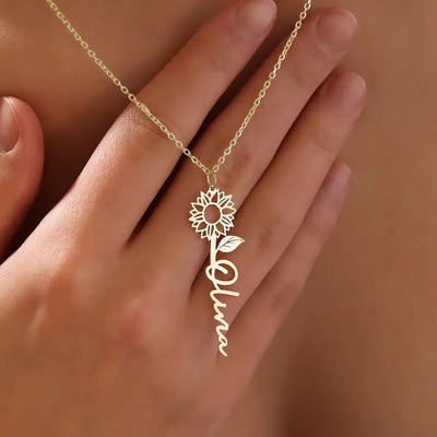 Gold sunflower Olivia name pendant necklace on hand