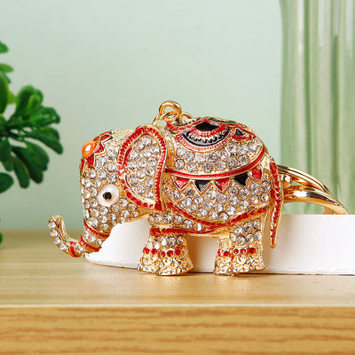 Main image 1 shows a supplied presentation of jeweled elephant keychains with visible attached key hardware.