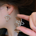 Open Flower Outline Stud Earrings in Gold and Silver view 4