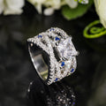 Silver Tone Crossover Ring With Blue And Clear Square Stones view 3