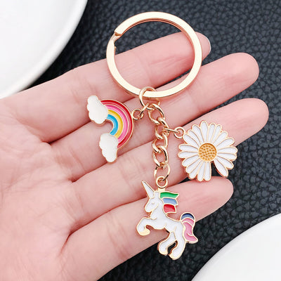 Overview showing the available color and design variations of the colorful rainbow unicorn daisy and cloud metal keychai