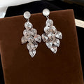 Silver Filigree Leaf Chandelier Earrings with Reflective Details view 7
