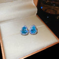 Blue Crystal Heart Stud Earrings In Two Metal Tones view 6