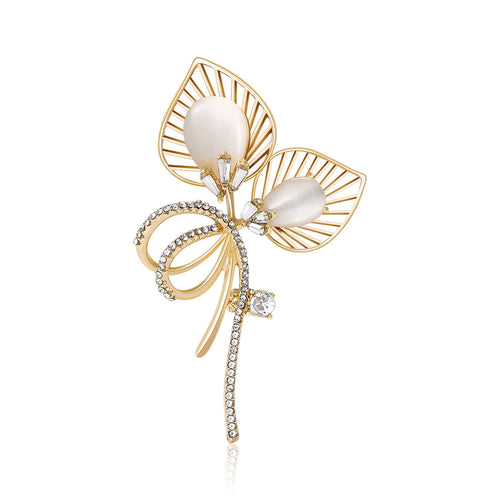 Gold cat-eye openwork leaf brooch with rhinestone bow front view