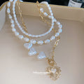 Layered Pearl And Gold Tone Heart Necklace Set With Decorative Accents view 4