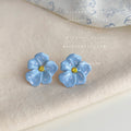 Pale Blue Five Petal Flower And Yellow Center Stud Earrings view 4