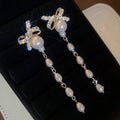 Crystal Bow Pearl Tassel Earrings With Polished Metal Tone Details view 6