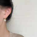 Gold Tone Hook Earrings With White Pearl Drops In Three Sizes view 2