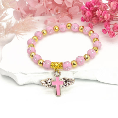 Pink cross bead stretch bracelet with winged cross charm on stone