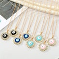 Gold Tone Crystal Halo Round and Heart Evil Eye Necklaces view 1
