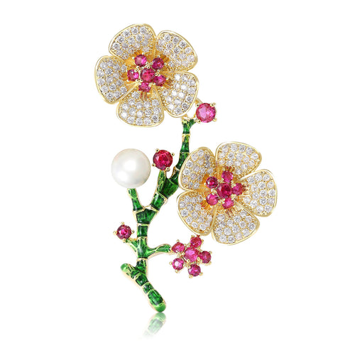 Front view of gold tone flowering branch with pink centers pearls and green enamel stems