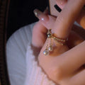 Gold Tone Double Layer Open Ring With Pearl Like Chain Dangles view 2