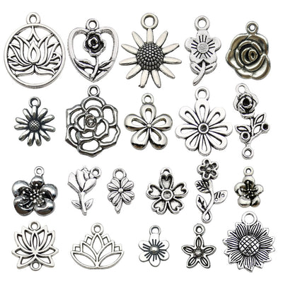 Metallic sunflower charms arranged on a light background