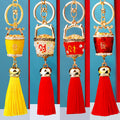 Classic and Revised Fortune Bucket Tassel Keychains in Five Color Options view 9