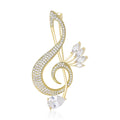 Crystal Treble Clef Brooch With Polished Metal And Sculpted Decorative Details view 1