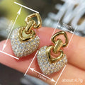 Gold Tone Double Heart Drop Earrings with Crystal Pave view 4