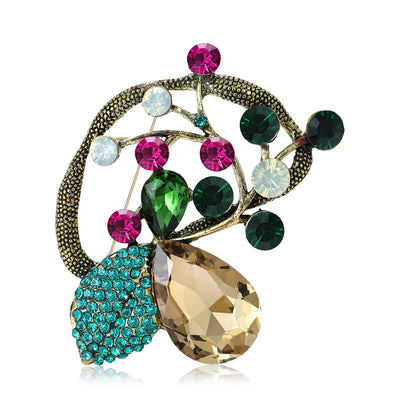 Antique Tone Peacock Brooch shown alone on a light background