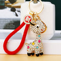 Jeweled Giraffe Keychains in White Pink and Blue with Braided Loops view 1