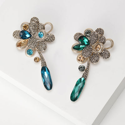 Front view showing the crystal flower brooch with green or blue teardrop dangle