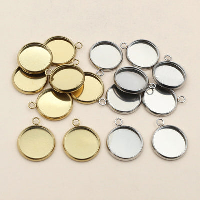 Round Stainless Steel Pendant Bezels With Single or Double Loops, grouped overview on a plain background