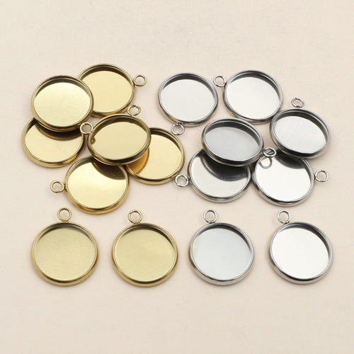Round Stainless Steel Pendant Bezels With Single or Double Loops, grouped overview on a plain background